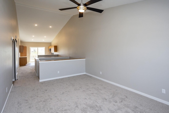 1102 Westview Dr, Huxley, IA 50124 - unfurnished room with a ceiling fan, lofted ceiling, light carpet, and recessed lighting
