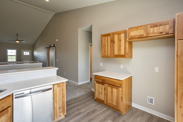 1102 Westview Dr, Huxley, IA 50124 - kitchen featuring stainless steel dishwasher, a barn door, lofted ceiling, light wood-style floors, and ceiling fan