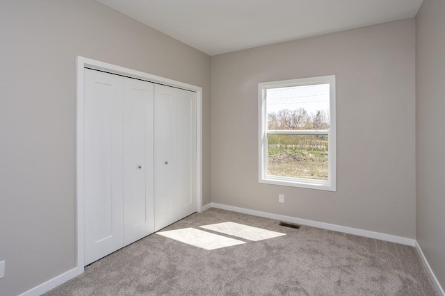1102 Westview Dr, Huxley, IA 50124 - unfurnished bedroom featuring carpet flooring and a closet