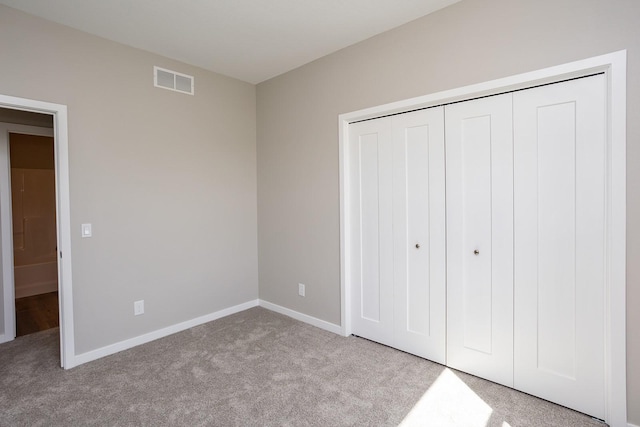 1102 Westview Dr, Huxley, IA 50124 - unfurnished bedroom featuring light colored carpet and a closet