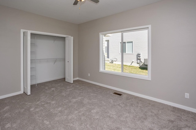 1102 Westview Dr, Huxley, IA 50124 - unfurnished bedroom featuring carpet flooring, a closet, and a ceiling fan
