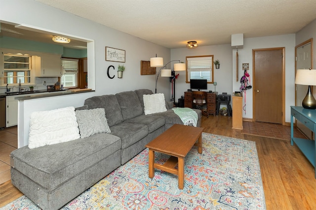 2525 27th Pl, Des Moines, IA 50310 - living area with wood finished floors and a textured ceiling