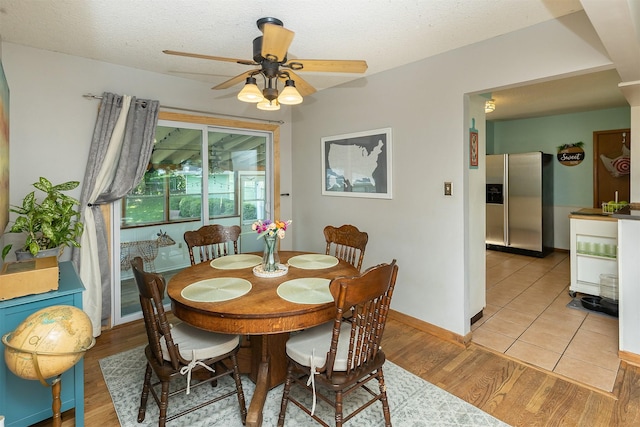 2525 27th Pl, Des Moines, IA 50310 - dining area featuring a ceiling fan, light wood-style flooring, and a textured ceiling