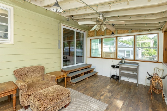 2525 27th Pl, Des Moines, IA 50310 - living area with hardwood / wood-style flooring, ceiling fan, cooling unit, and wood walls