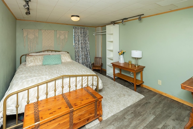 2525 27th Pl, Des Moines, IA 50310 - bedroom with rail lighting, wood finished floors, and ornamental molding