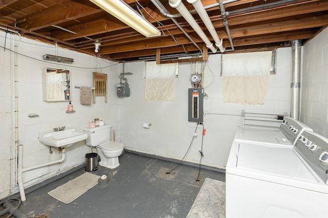 2525 27th Pl, Des Moines, IA 50310 - unfinished below grade area featuring washing machine and dryer, electric panel, and concrete block wall