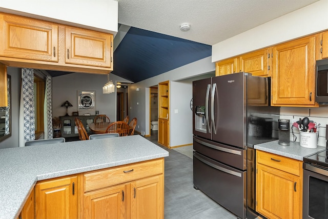 502 5th Ave SW, Altoona, IA 50009 - kitchen with refrigerator with ice dispenser, stainless steel electric range oven, vaulted ceiling, light countertops, and light wood finished floors