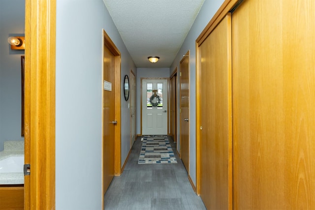 502 5th Ave SW, Altoona, IA 50009 - hall with a textured ceiling and wood finished floors