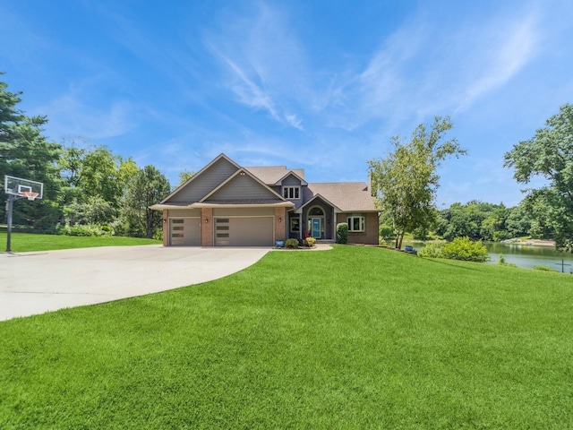 36508 Meadow Ln, Cumming, IA 50061 - craftsman house featuring concrete driveway, a front yard, brick siding, and an attached garage