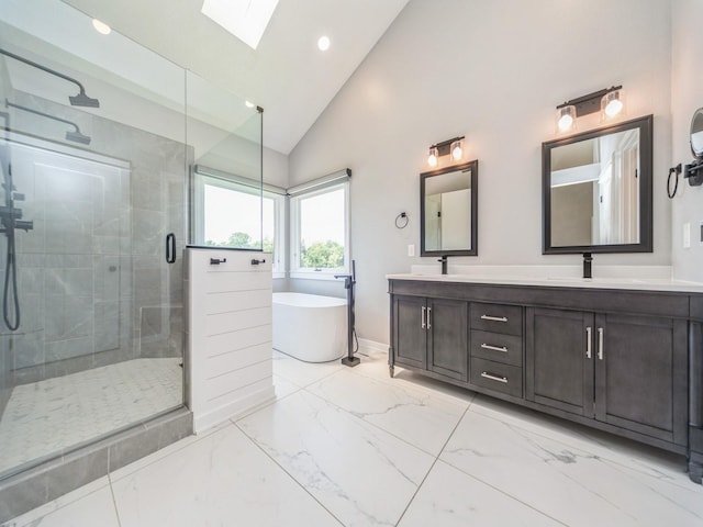 36508 Meadow Ln, Cumming, IA 50061 - bathroom with double vanity, a stall shower, a soaking tub, vaulted ceiling, and a skylight