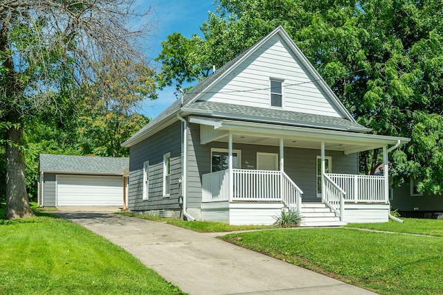 611 W 2nd St S, Newton, IA 50208 - view of front facade featuring roof with shingles, covered porch, a front yard, an outdoor structure, and a garage