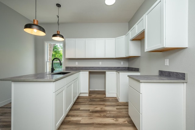 611 W 2nd St S, Newton, IA 50208 - kitchen with light wood-style flooring and white cabinetry