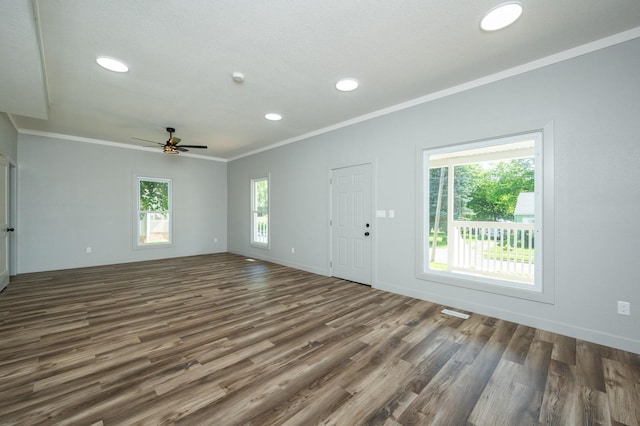 611 W 2nd St S, Newton, IA 50208 - unfurnished living room featuring crown molding, wood finished floors, ceiling fan, and recessed lighting