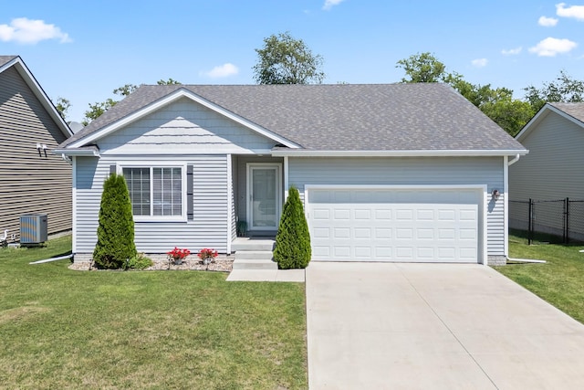 4315 E 48th St, Des Moines, IA 50317 - ranch-style home featuring a garage, concrete driveway, and a shingled roof