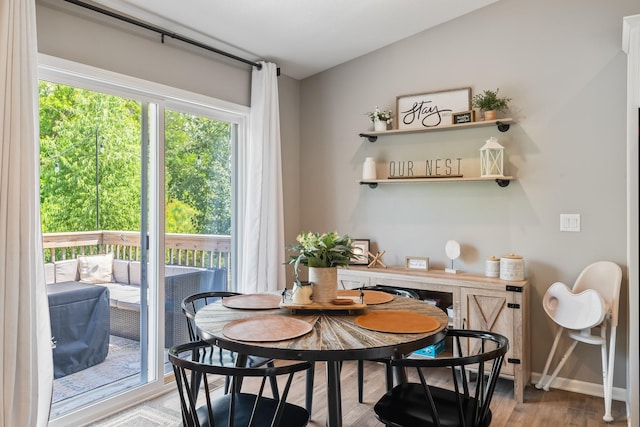 4315 E 48th St, Des Moines, IA 50317 - dining room featuring baseboards and wood finished floors