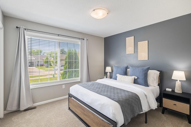4315 E 48th St, Des Moines, IA 50317 - bedroom with carpet floors and baseboards