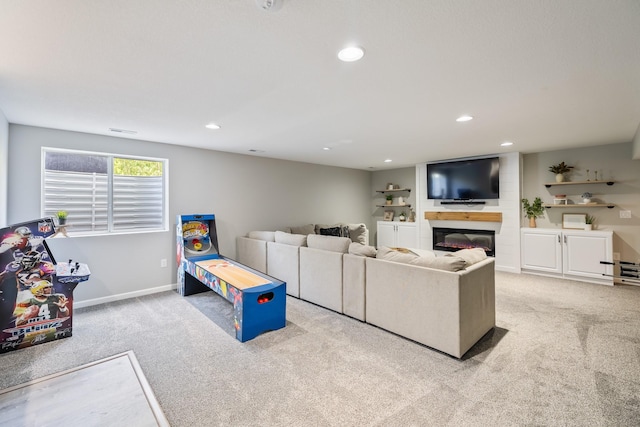 4315 E 48th St, Des Moines, IA 50317 - living area featuring carpet, recessed lighting, and a glass covered fireplace