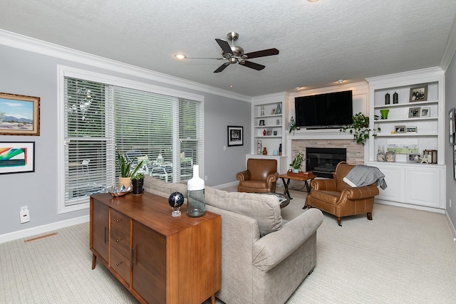 14092 Lake Pointe Dr, Clive, IA 50325 - living area featuring light colored carpet, ceiling fan, a fireplace, ornamental molding, and a textured ceiling