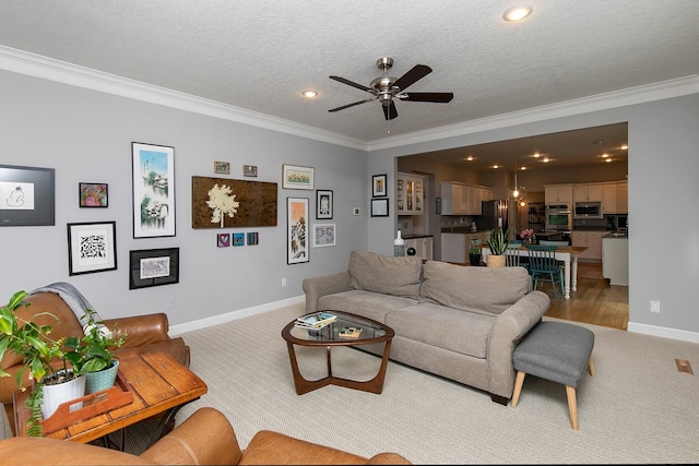 14092 Lake Pointe Dr, Clive, IA 50325 - living room with light colored carpet, ornamental molding, a ceiling fan, recessed lighting, and a textured ceiling