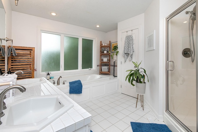 14092 Lake Pointe Dr, Clive, IA 50325 - bathroom with a stall shower, tile patterned flooring, and a bath
