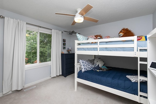 14092 Lake Pointe Dr, Clive, IA 50325 - bedroom featuring carpet, a textured ceiling, and ceiling fan