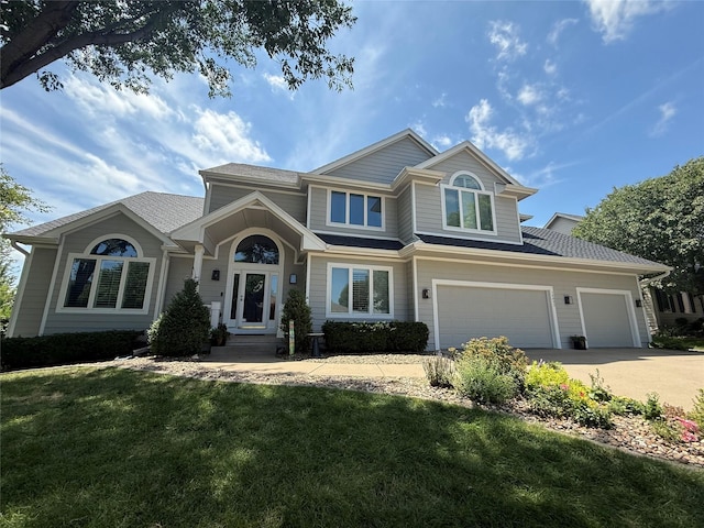 14092 Lake Pointe Dr, Clive, IA 50325 - view of front of home with driveway, a front yard, and an attached garage