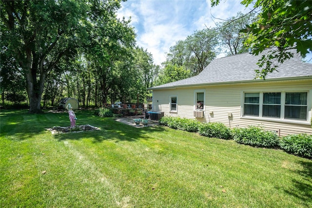 808 Bridge St, Redfield, IA 50233 - view of green lawn with cooling unit and a patio area