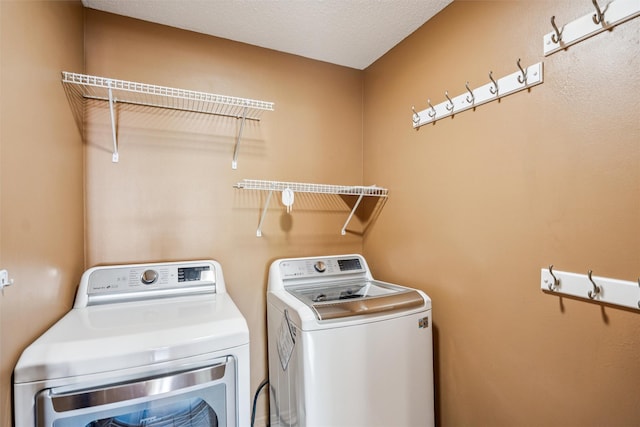 1517 SE Delaware Ave Unit 2, Ankeny, IA 50021 - washroom featuring washing machine and clothes dryer