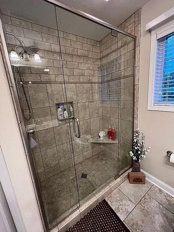 2279 Pheasant Ridge Ln, Ames, IA 50010 - full bathroom with tile patterned flooring and a stall shower