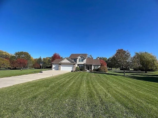 2279 Pheasant Ridge Ln, Ames, IA 50010 - view of front of property featuring concrete driveway, a front yard, and an attached garage