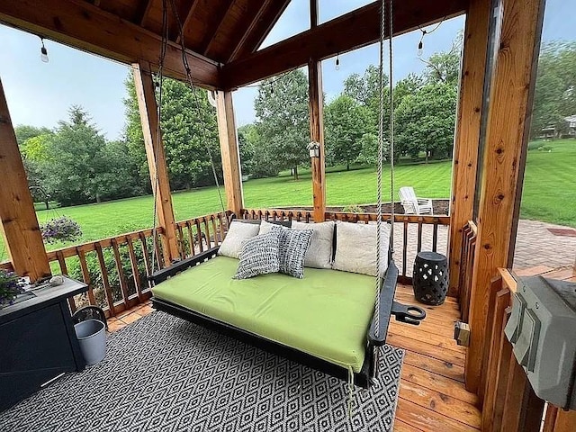 2279 Pheasant Ridge Ln, Ames, IA 50010 - sunroom / solarium featuring plenty of natural light and view of wooded area