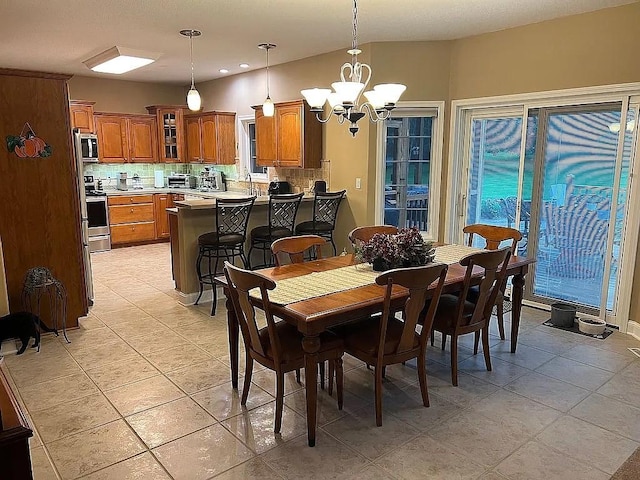 2279 Pheasant Ridge Ln, Ames, IA 50010 - dining room featuring a chandelier and light tile patterned floors