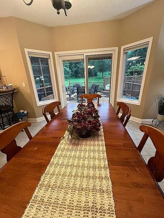 2279 Pheasant Ridge Ln, Ames, IA 50010 - dining space featuring healthy amount of natural light and wood finished floors