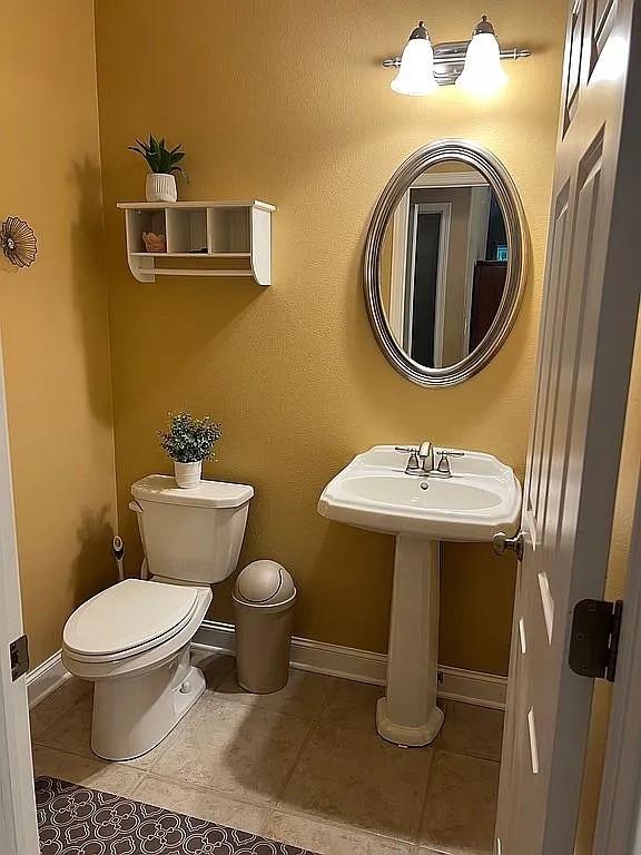 2279 Pheasant Ridge Ln, Ames, IA 50010 - half bathroom with toilet and tile patterned flooring