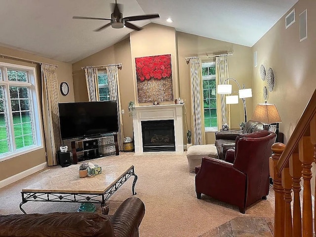 2279 Pheasant Ridge Ln, Ames, IA 50010 - living room with a ceiling fan, vaulted ceiling, carpet flooring, and a fireplace