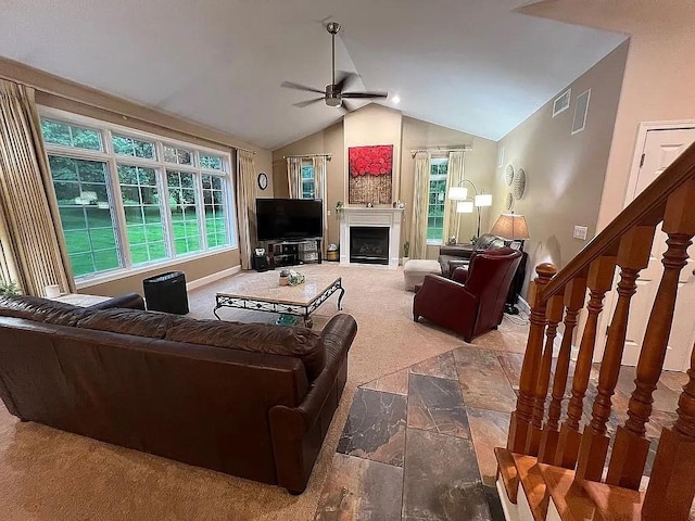 2279 Pheasant Ridge Ln, Ames, IA 50010 - carpeted living area with ceiling fan, vaulted ceiling, a fireplace, plenty of natural light, and stairway