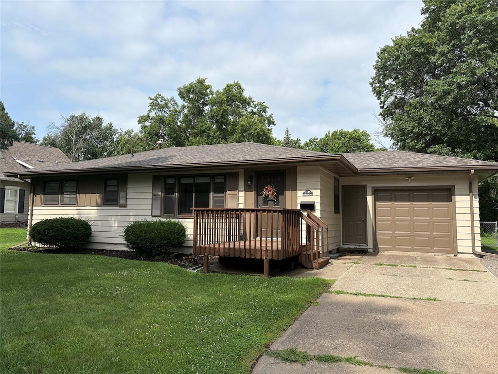 1105 N Buxton St, Indianola, IA 50125 - ranch-style home featuring a garage, concrete driveway, a front yard, and covered porch