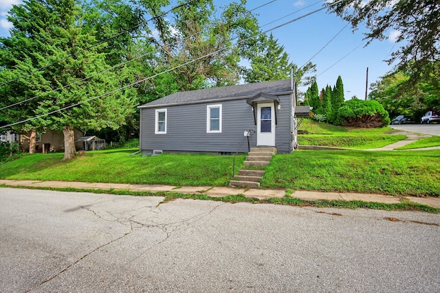 34 E Broadway St, Colfax, IA 50054 - bungalow with entry steps and a front lawn