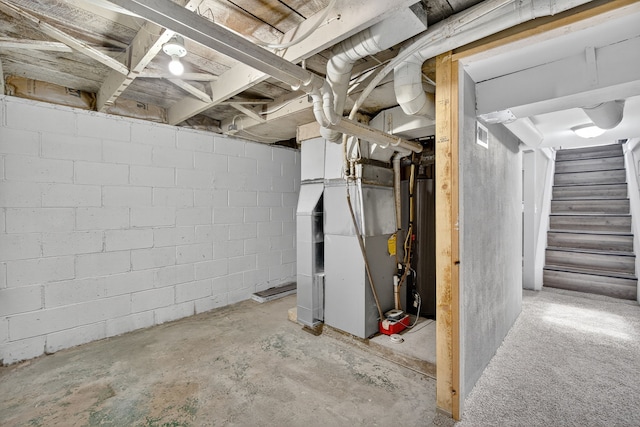 34 E Broadway St, Colfax, IA 50054 - unfinished basement with stairway and heating unit