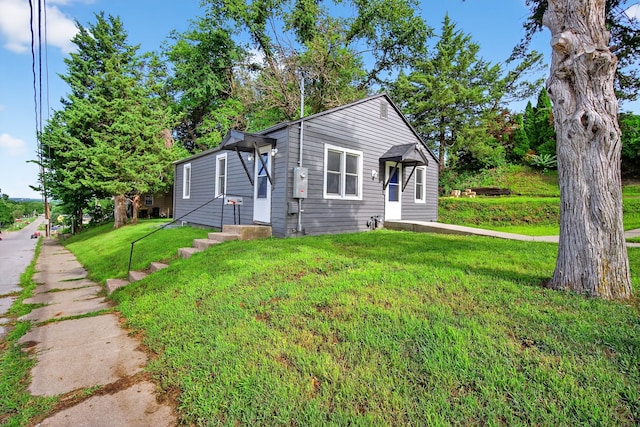 34 E Broadway St, Colfax, IA 50054 - bungalow with a front lawn