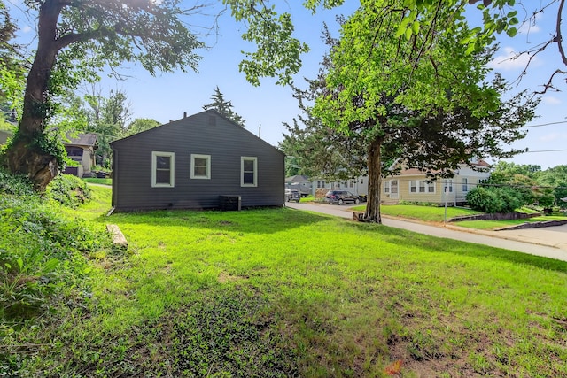 34 E Broadway St, Colfax, IA 50054 - view of property exterior with a yard