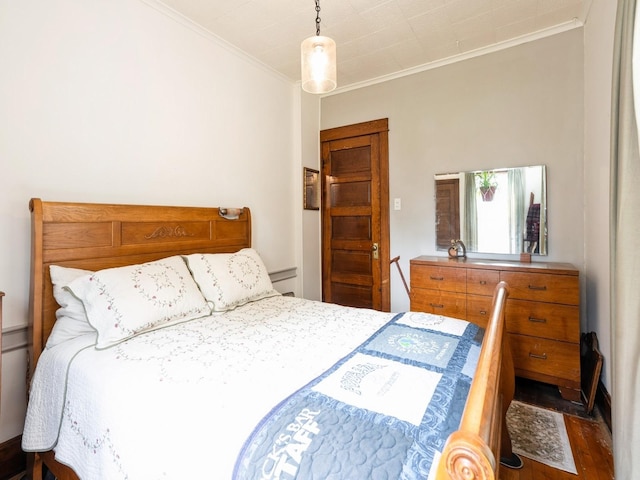 3917 11th St, Des Moines, IA 50313 - bedroom featuring crown molding and wood finished floors
