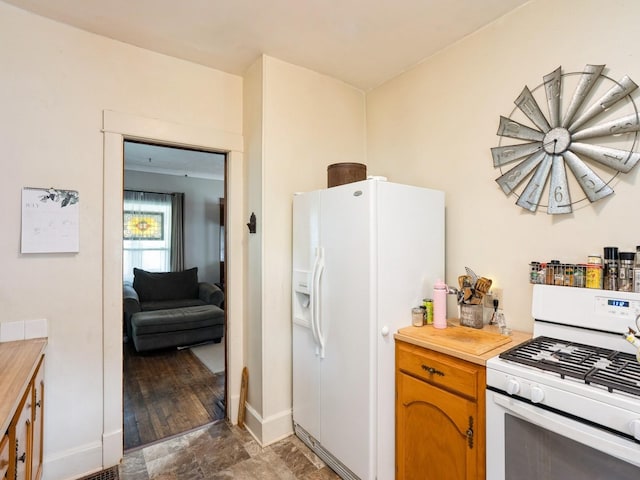 3917 11th St, Des Moines, IA 50313 - kitchen with white appliances and butcher block counters