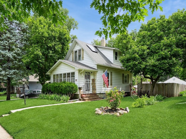 3917 11th St, Des Moines, IA 50313 - bungalow-style house featuring a shingled roof and a chimney