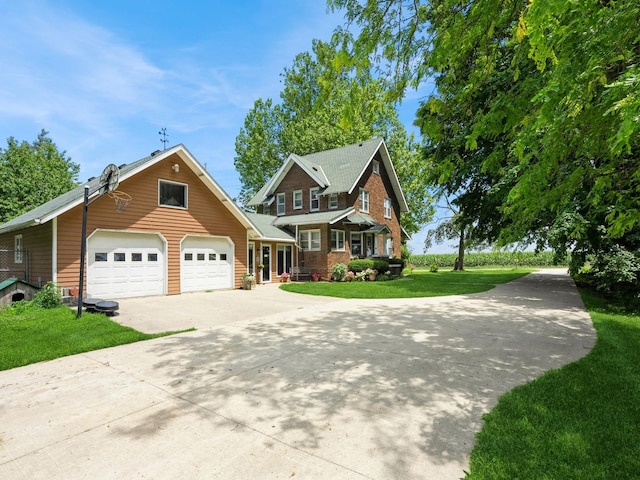 4987 E 28th St N, Newton, IA 50208 - view of front of home with concrete driveway and a front yard