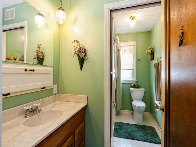 4987 E 28th St N, Newton, IA 50208 - full bath with vanity, tile patterned floors, and a shower with shower curtain