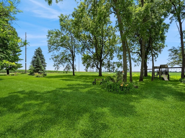 4987 E 28th St N, Newton, IA 50208 - view of green lawn with a playground