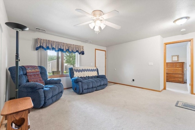 827 SW 46th St, Ankeny, IA 50023 - carpeted living area with ceiling fan and baseboards