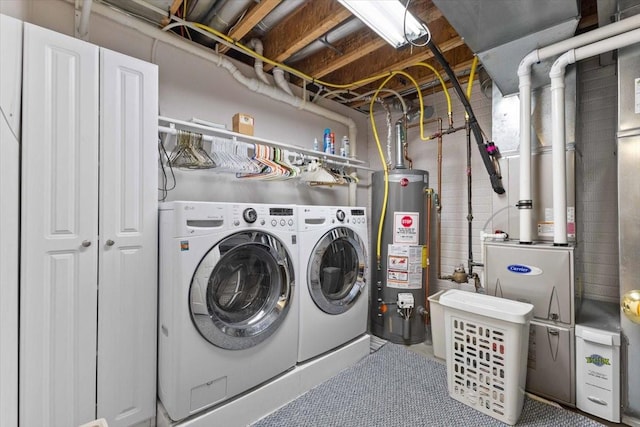 827 SW 46th St, Ankeny, IA 50023 - washroom featuring gas water heater, separate washer and dryer, and heating unit
