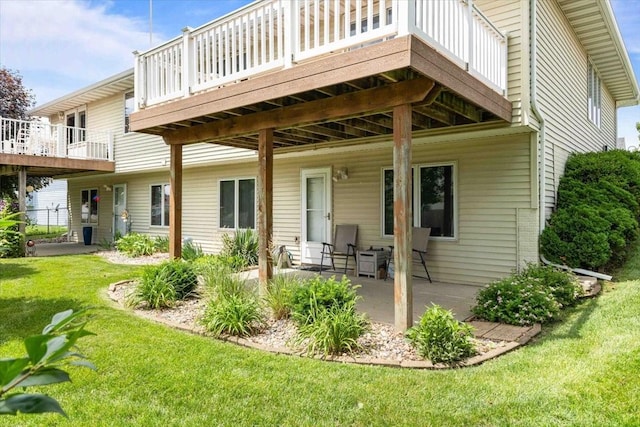 827 SW 46th St, Ankeny, IA 50023 - rear view of house featuring a yard, a wooden deck, and a patio